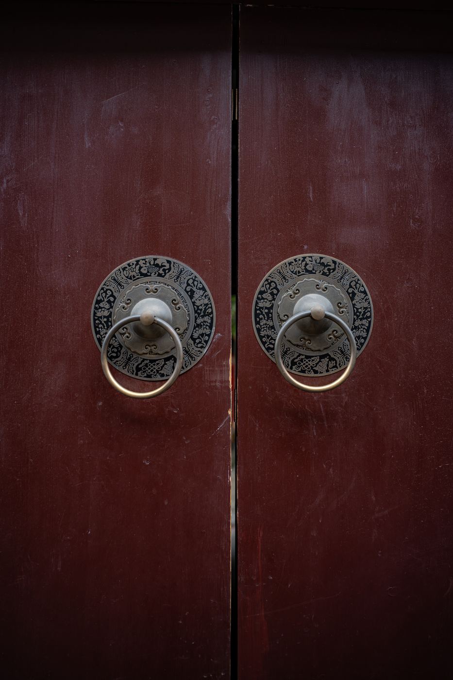 Vermilion temple doors with iron ring handles