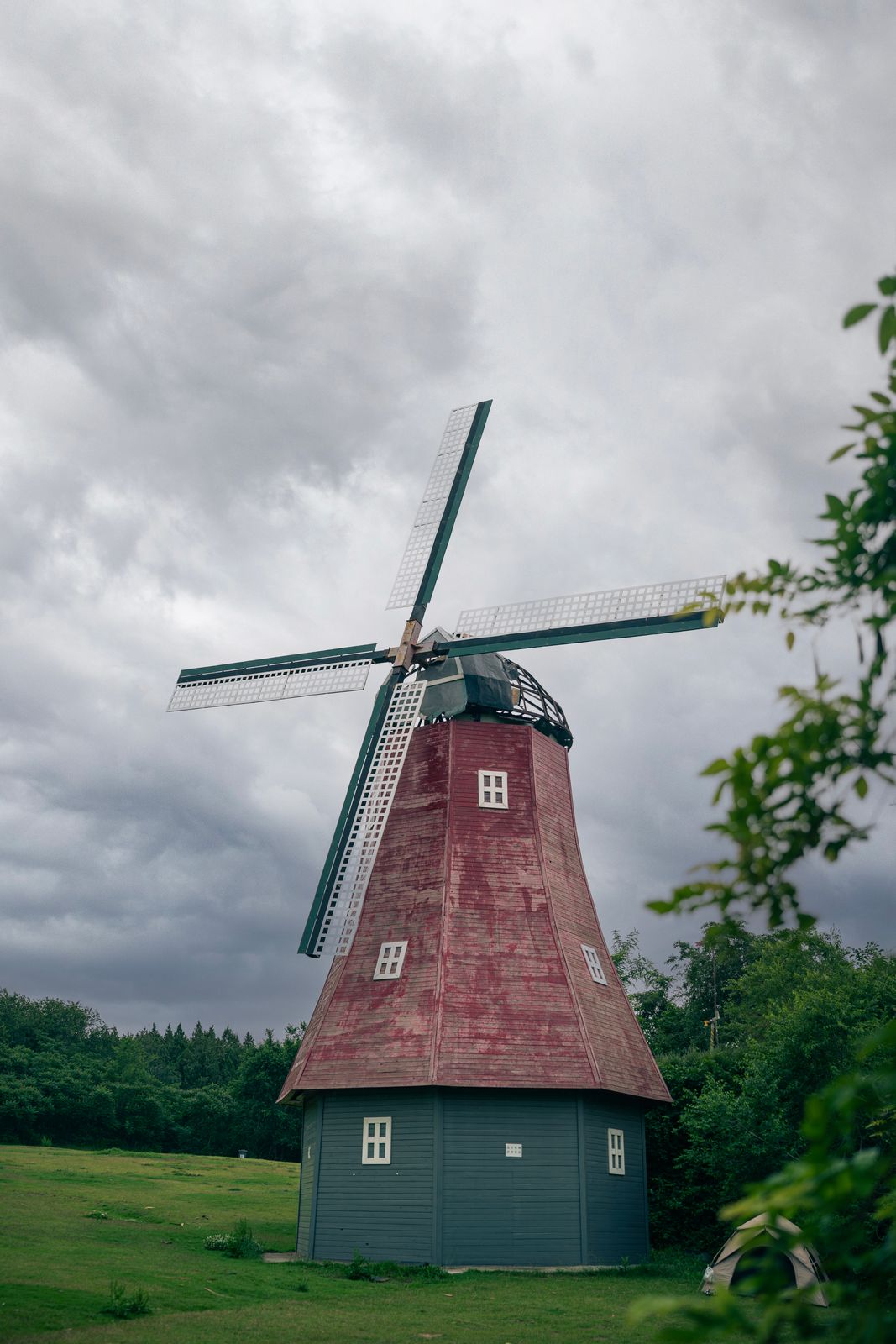 Historic windmill under a moody overcast sky